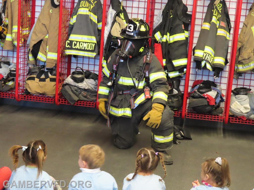 Jacob Reardon shows his turnot gear to a preschool class on 3/18/2025.
