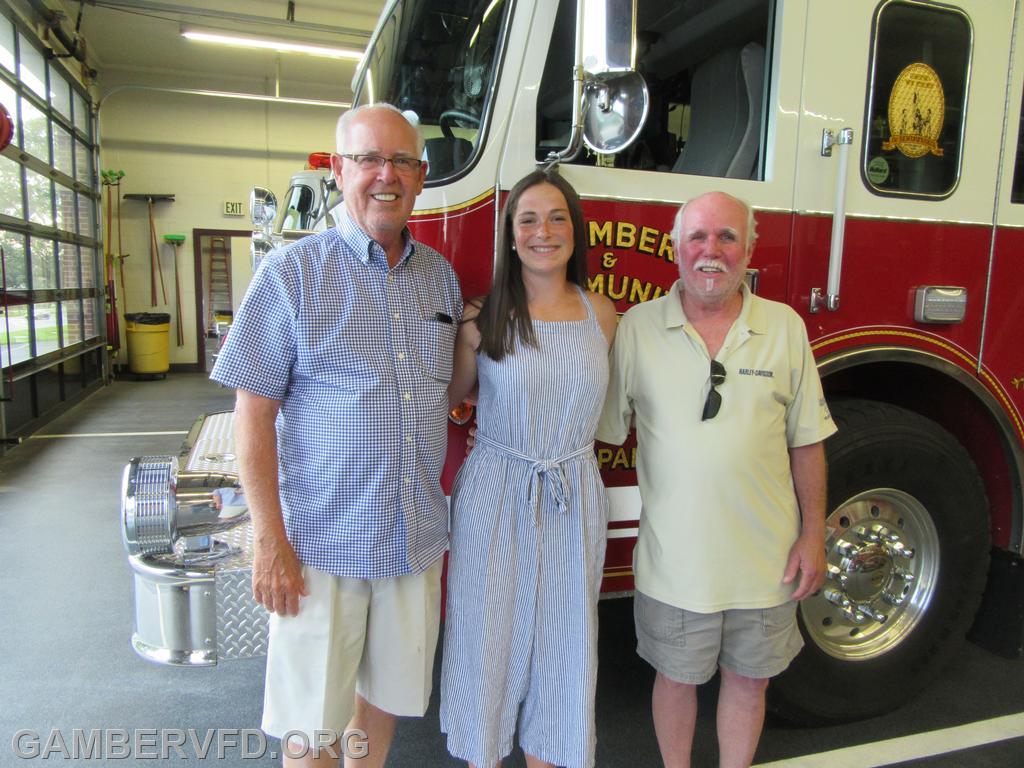 Oscar Brothers Memorial Scholarship winner Lydia Houle received her full scholarship from Gary Brothers (l) and Terry Brothers on Friday, June 18 at the Gamber & Community Fire Company station.
