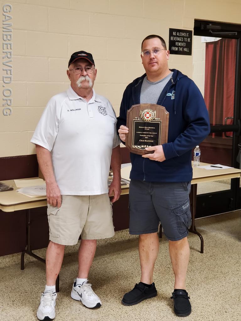 Chad Hastings accepts the Herman Hoff Memorial Award from President Dale Bollinger.