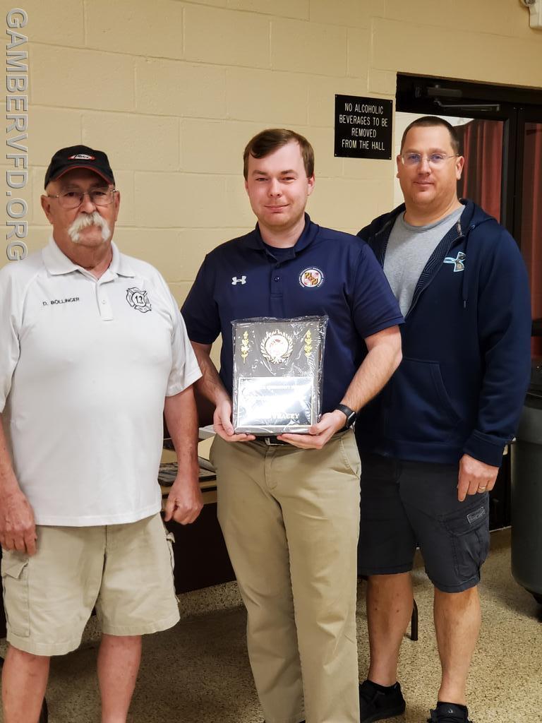 Todd Tracey accepts the Administrative Member of the Year award from President Dale Bollinger (L) and 1st Vice President/Captain Chad Hastings.