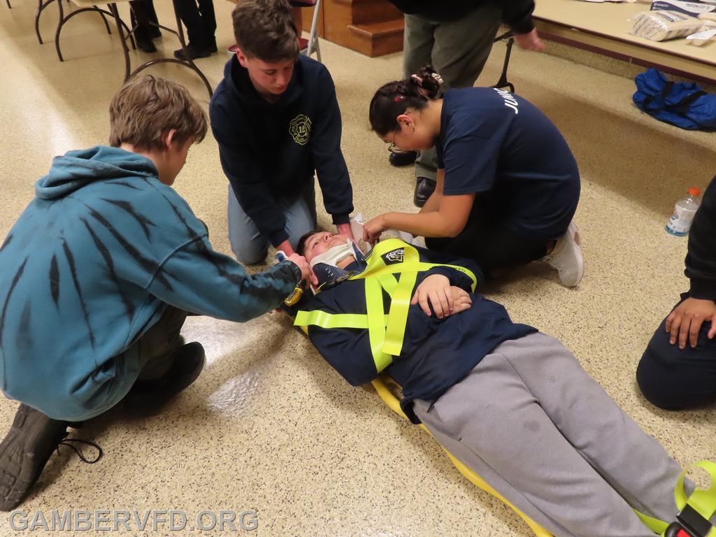 Juniors work on patient immobilization at the EMS station.