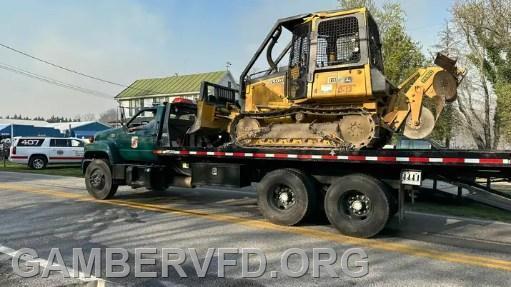 A Maryland Dept. of Natural Resources bulldozer arrives at the scene.