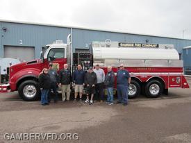 The new tanker upon delivery. Committee members (l to r) Emily Franklin, Chuck Doyle, Sales Representative, Bob Pursel, Chad Hastings, Dale Bollinger, Mike Green, Shawn Chenoweth, and Charlie Green.