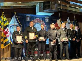 DFEMS EMS 103 Lt. Briana Stull, (l to r) Gamber Fire Chief Chad Hastings, DFEMS FF/PM Jess Jacobs and FF/EMT Tyler Drawbaugh, and Gamber volunteer FF/EMT Jacob Sherfey, DFEMS Deputy Chief Paul Supko, and DFEMS Assistant Chief Dennis Brothers.