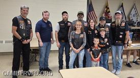 Gamber President Todd Tracey (2nd from left) accepts a donation from Bikers for Cause Maryland Chapter 6 members and their President, Scott "Spike" Dickson (far right.)